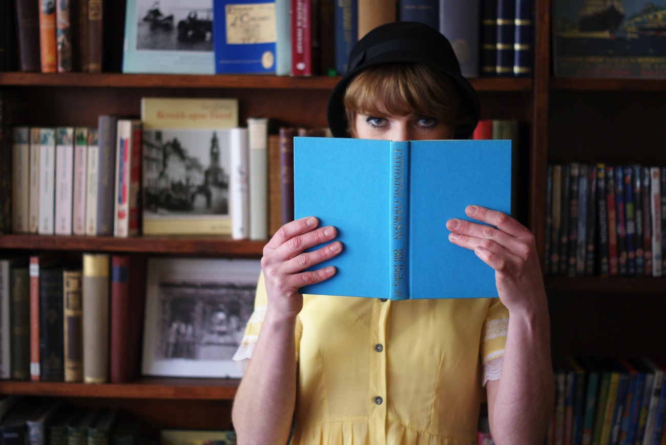 Anna holding a book